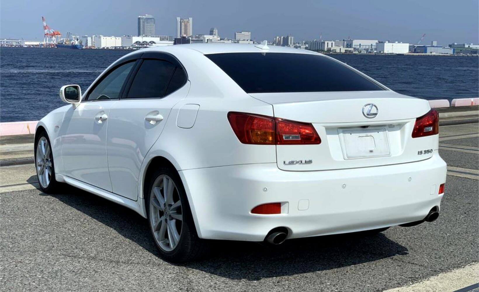 Rear view of a white Lexus IS350, imported from Japan.