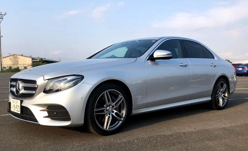 A silver Mercedes-Benz E-Class sedan imported from Japan