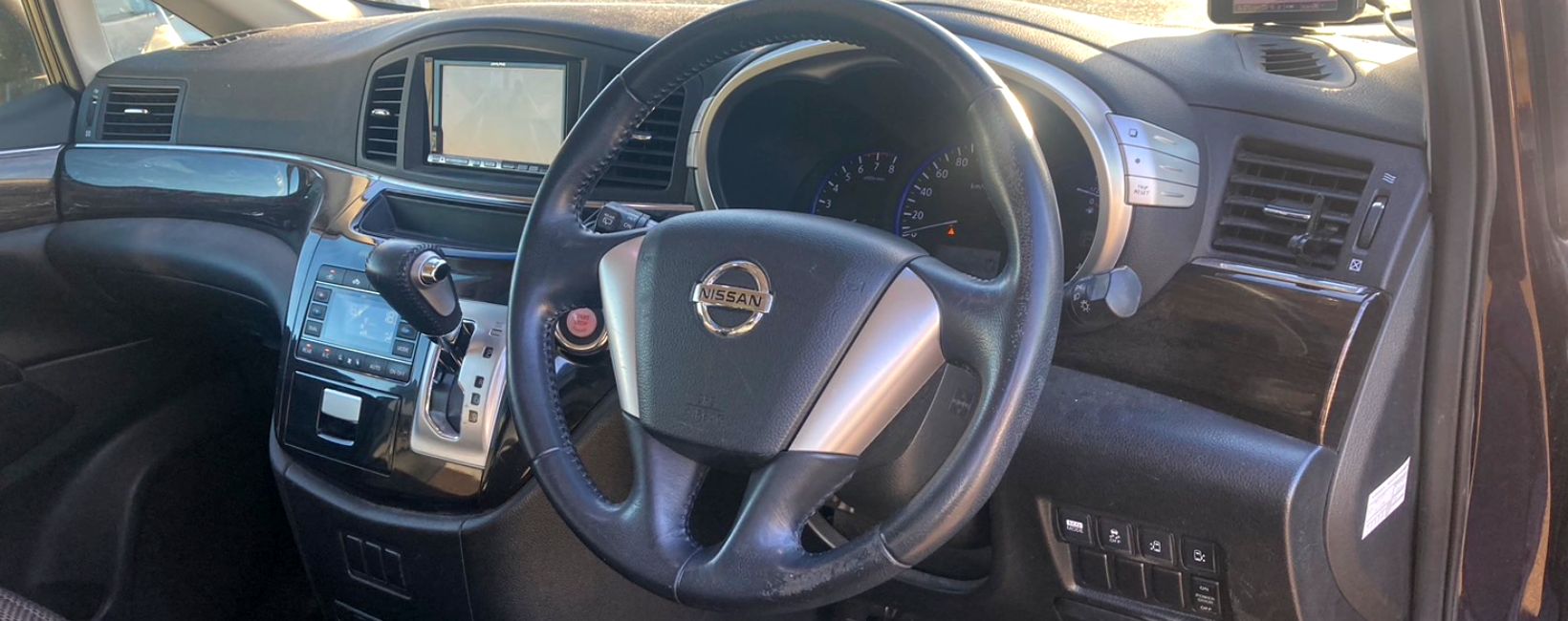 A steering wheel of a Japanese Nissan Elgrand. Are Nissan Elgrands reliable?